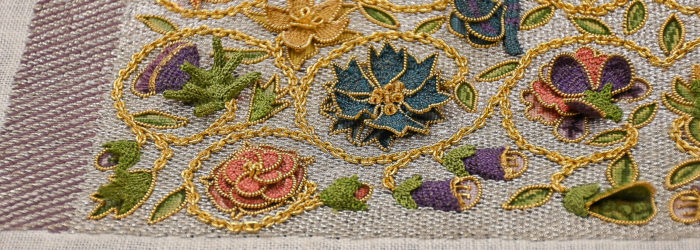 Close-up of embroidered textile with a floral design