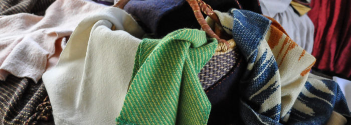 Basket of assorted woven textiles